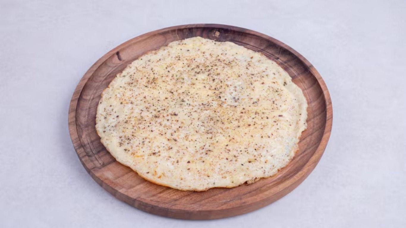 Thin flatbread on wooden plate