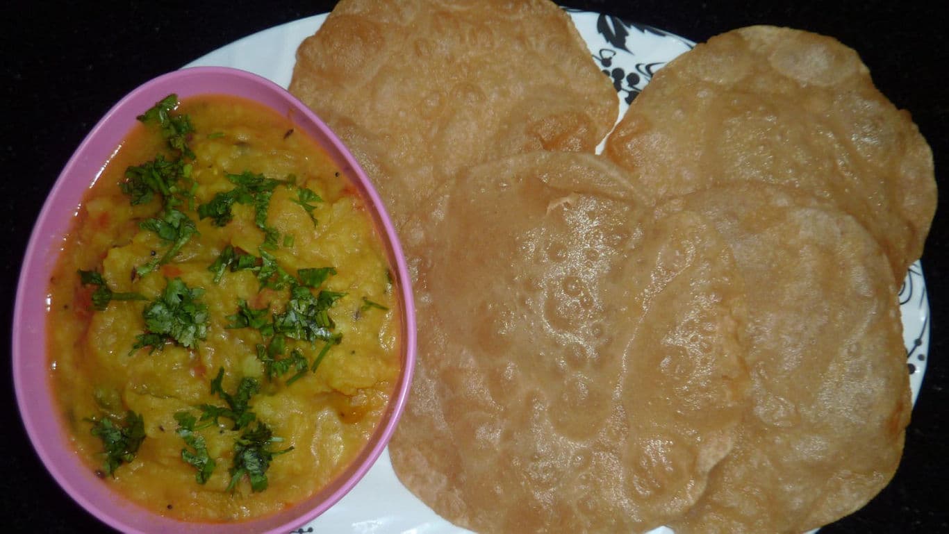 Indian puri bread served with potato curry