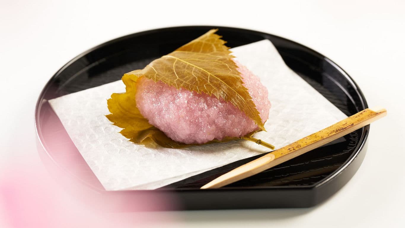 Traditional Japanese Sakura Mochi on Black Plate