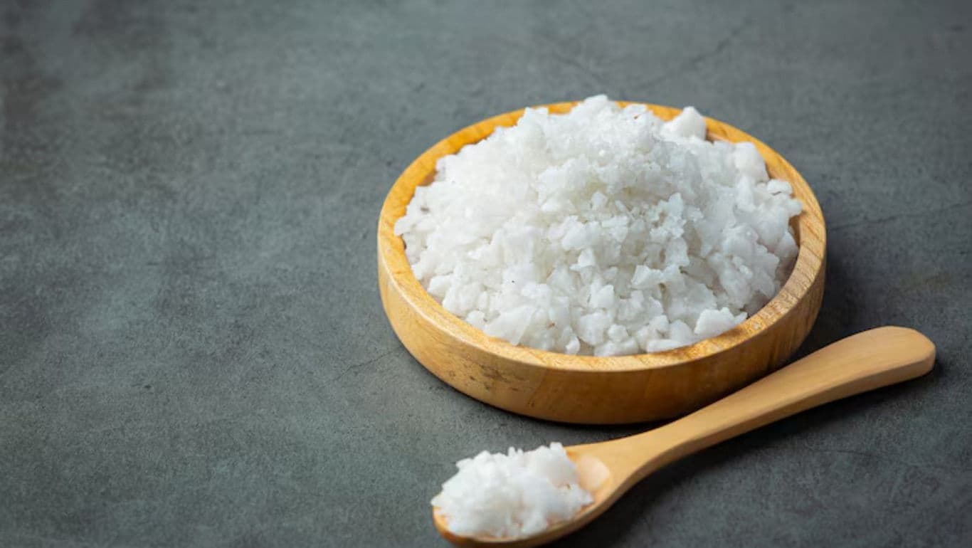 Wooden bowl of coarse white salt