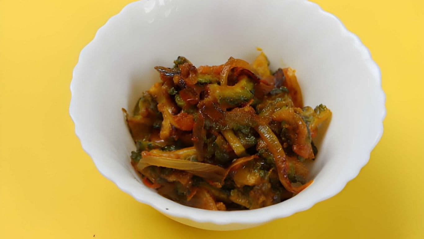 Bitter gourd stir fry served in white bowl