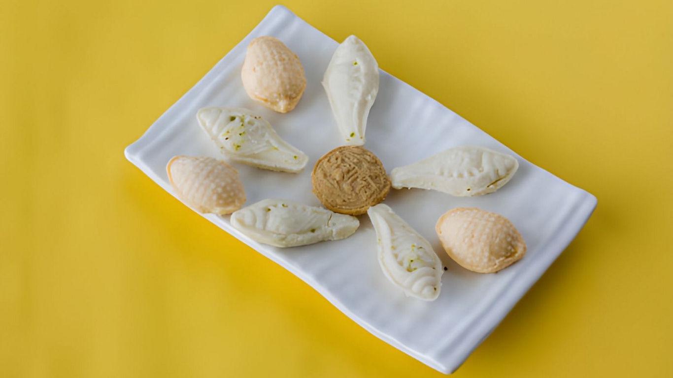 Traditional sweets on white ceramic plate