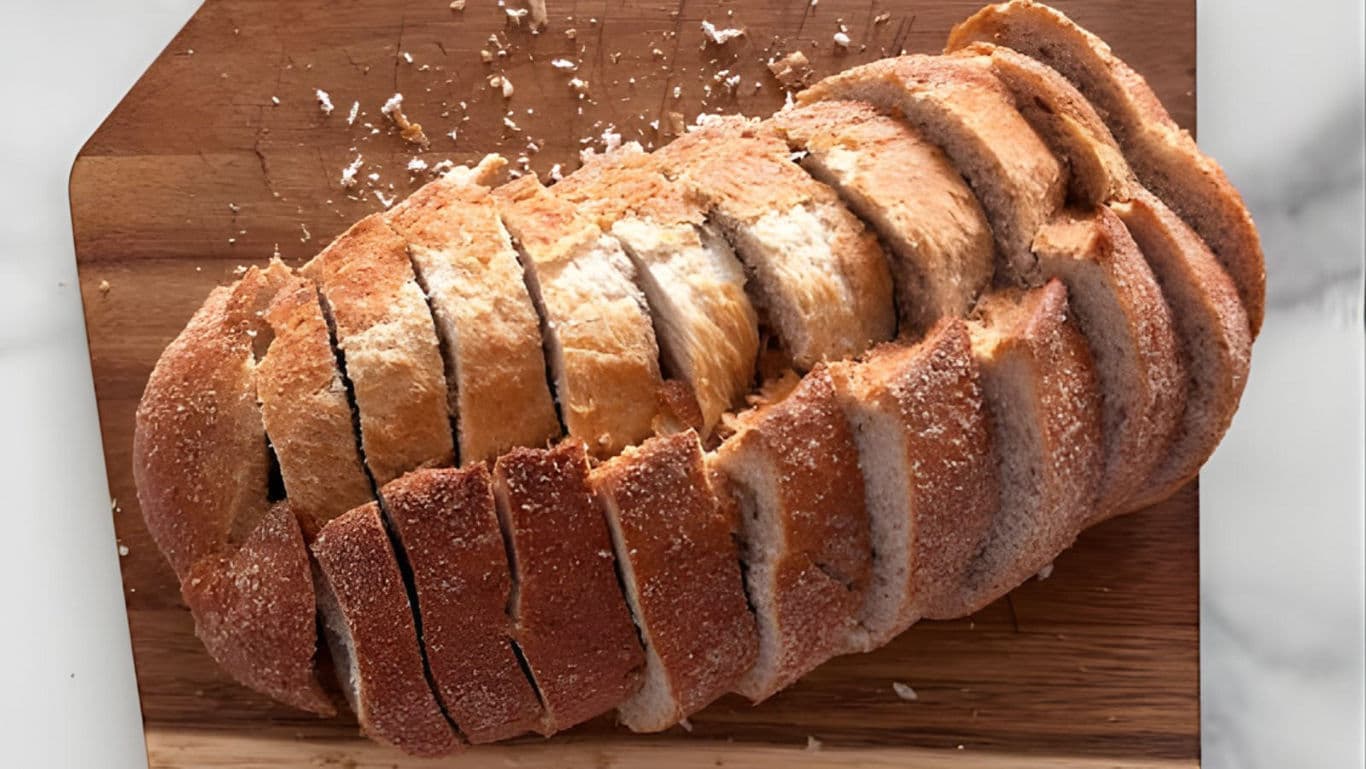Freshly Sliced Rustic Bread on Wooden Board