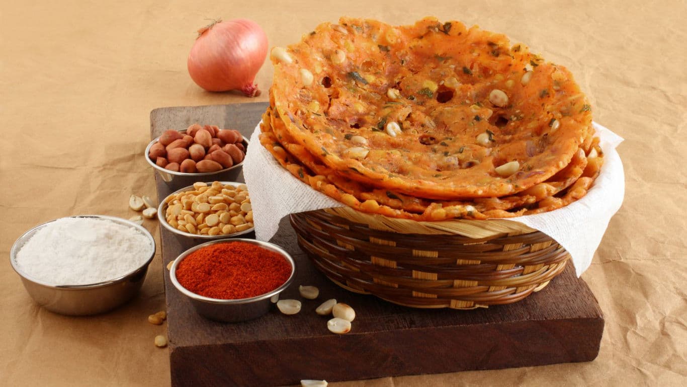 Crispy Indian flatbread with assorted ingredients displayed