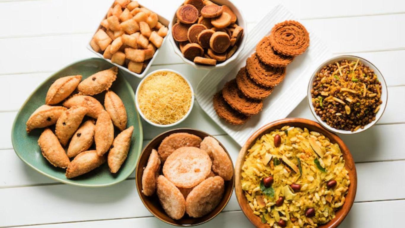 Assorted Indian snacks on white table