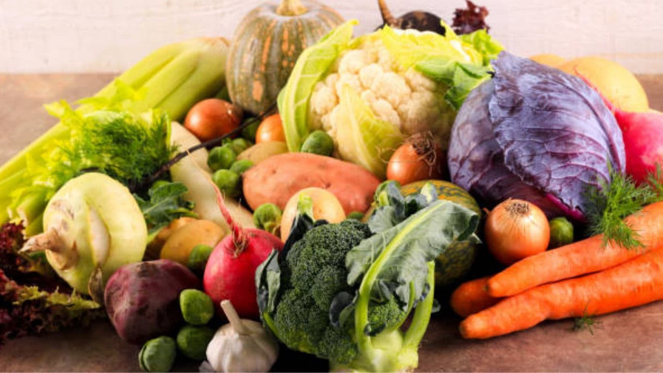 Assorted Fresh Vegetables on Rustic Table Surface