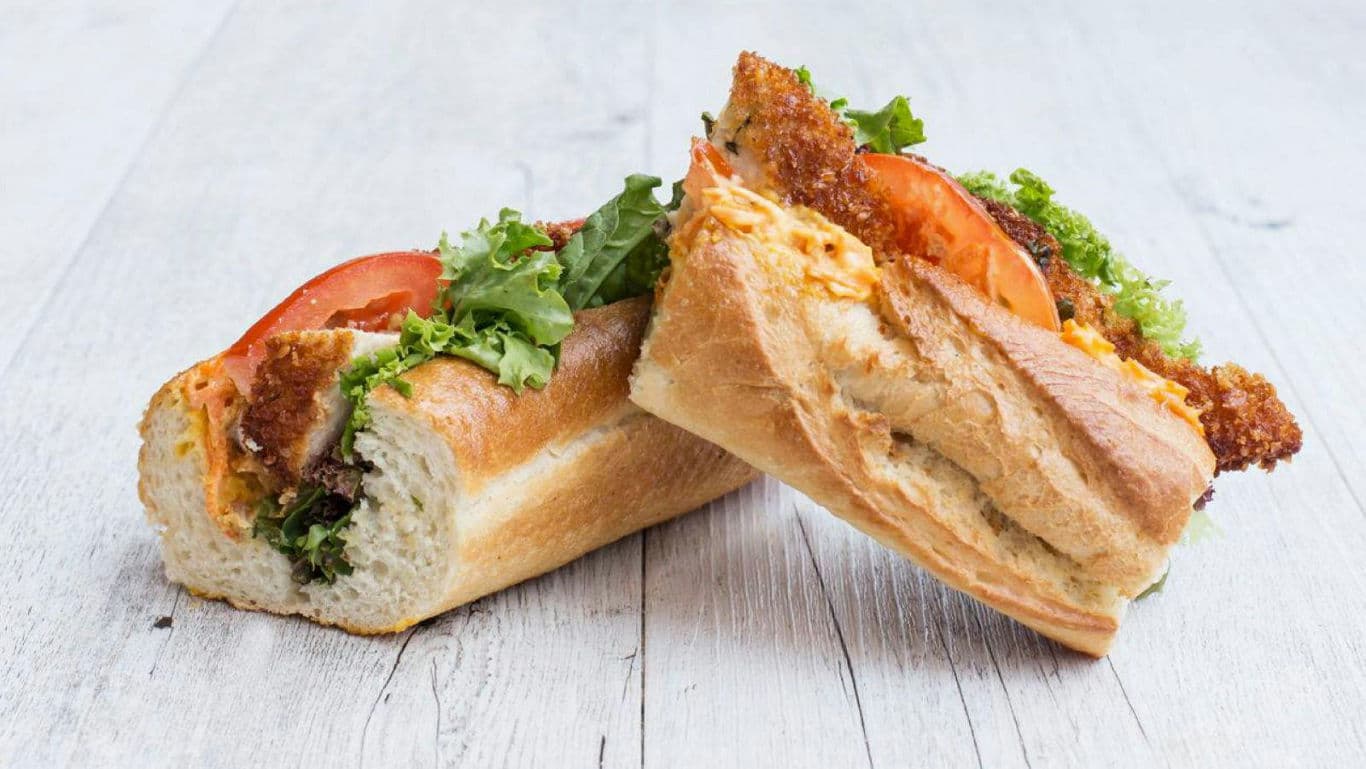 Crispy chicken baguette sandwich with vegetables