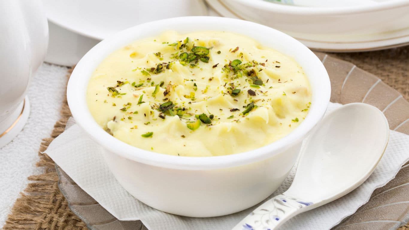 Creamy dessert pudding topped with pistachios