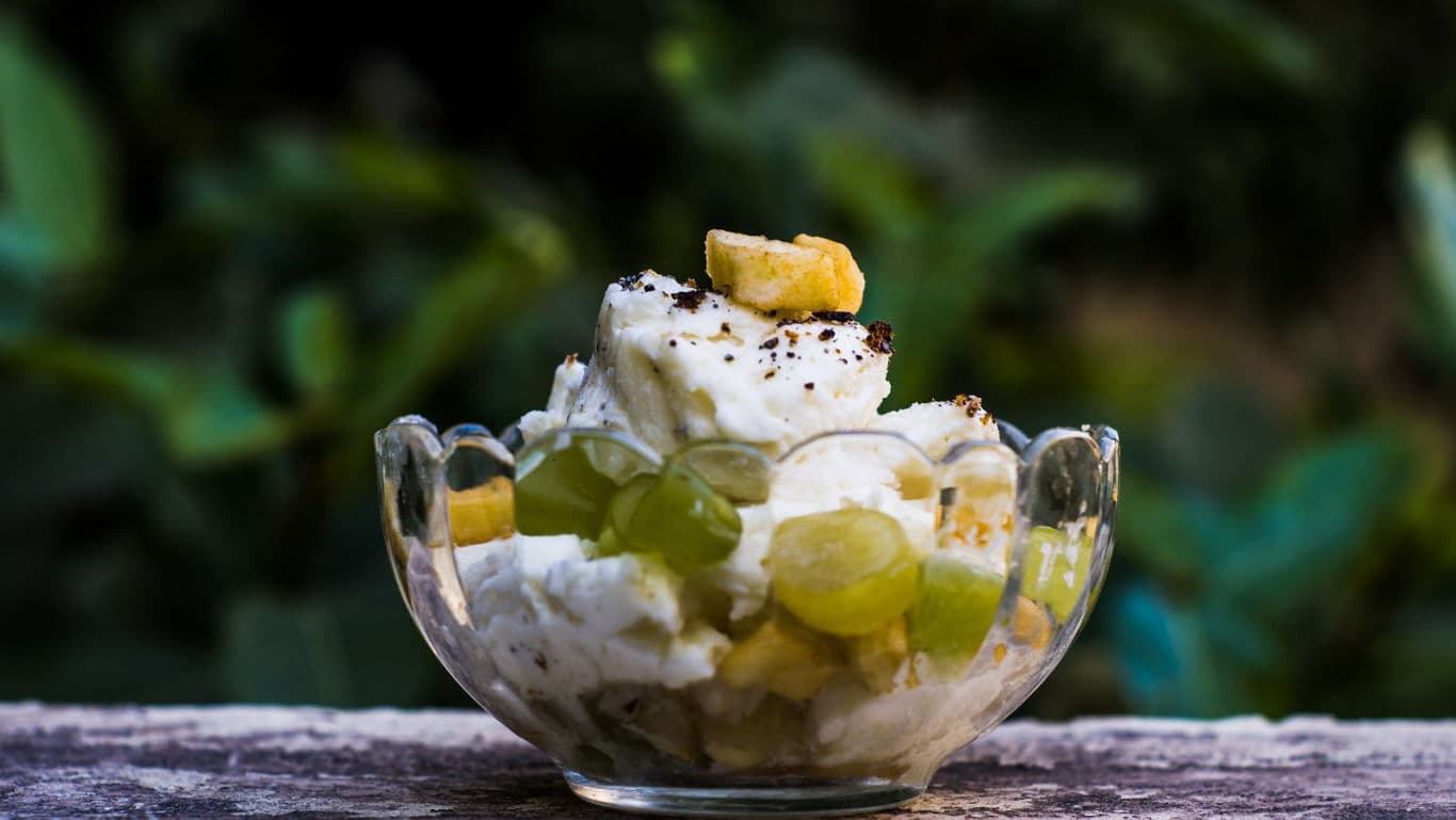 Fruit and cream dessert in glass bowl