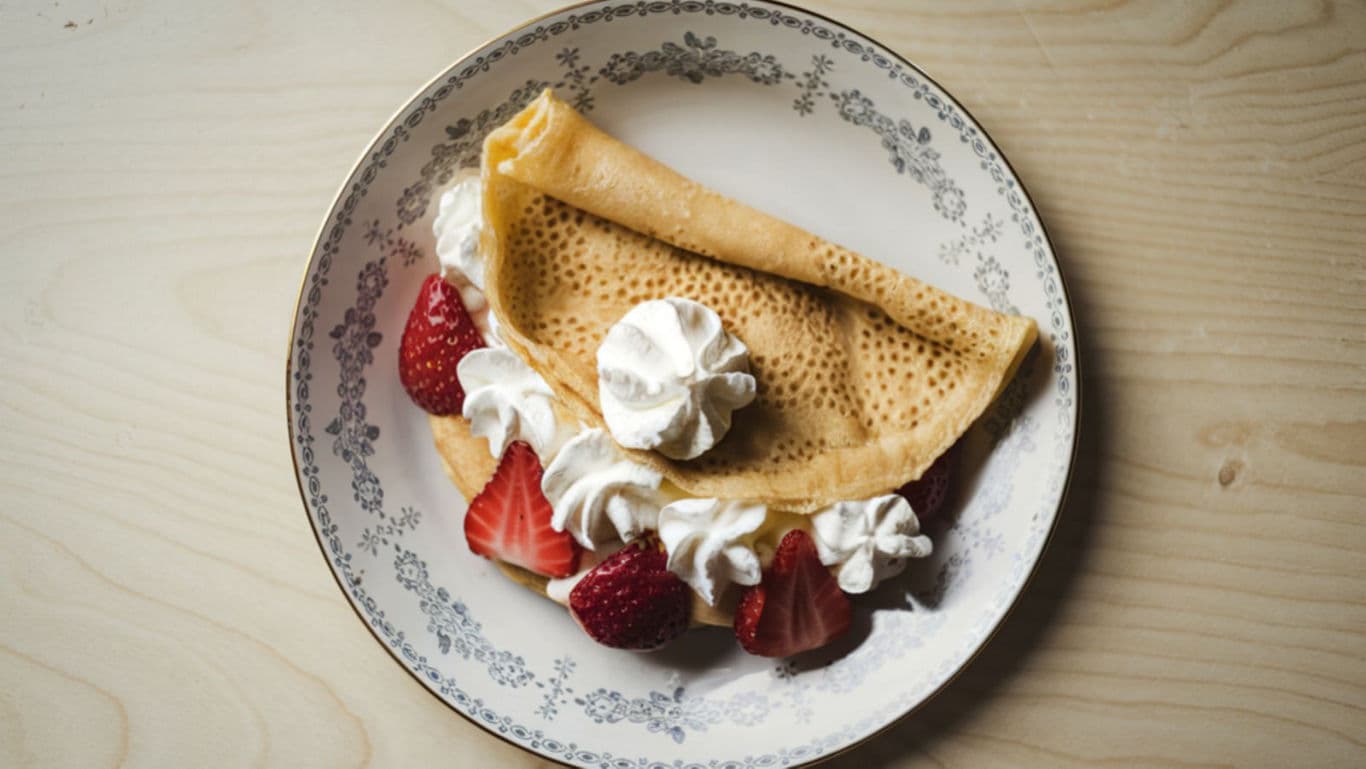 Strawberry crepe with whipped cream dessert