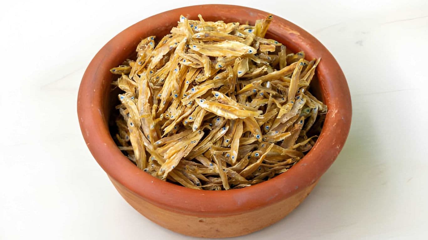 Clay bowl filled with dried anchovy fish