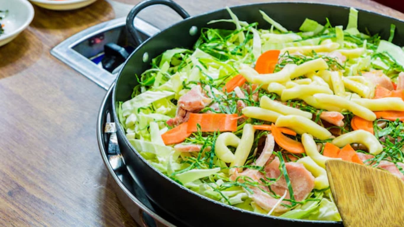 Colorful vegetable and meat stir fry in skillet