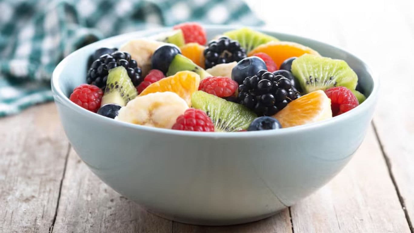 Fresh colorful mixed fruit salad in bowl
