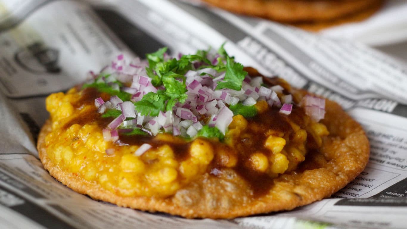 Indian street food papdi topped with lentils and chutney