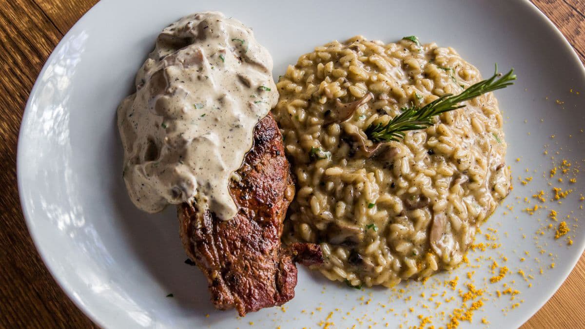 Mushroom risotto served with fresh salad 