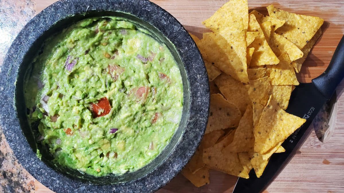 Fresh guacamole served with tortilla chips