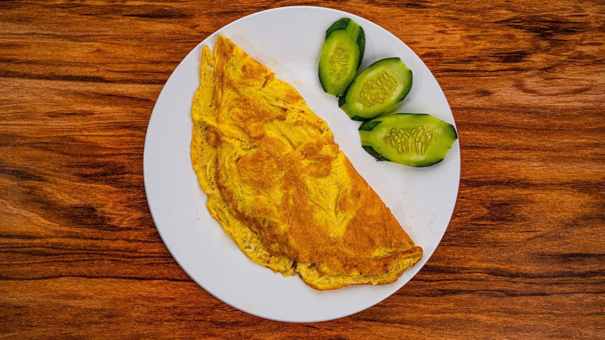 Egg omelette on a white plate 
