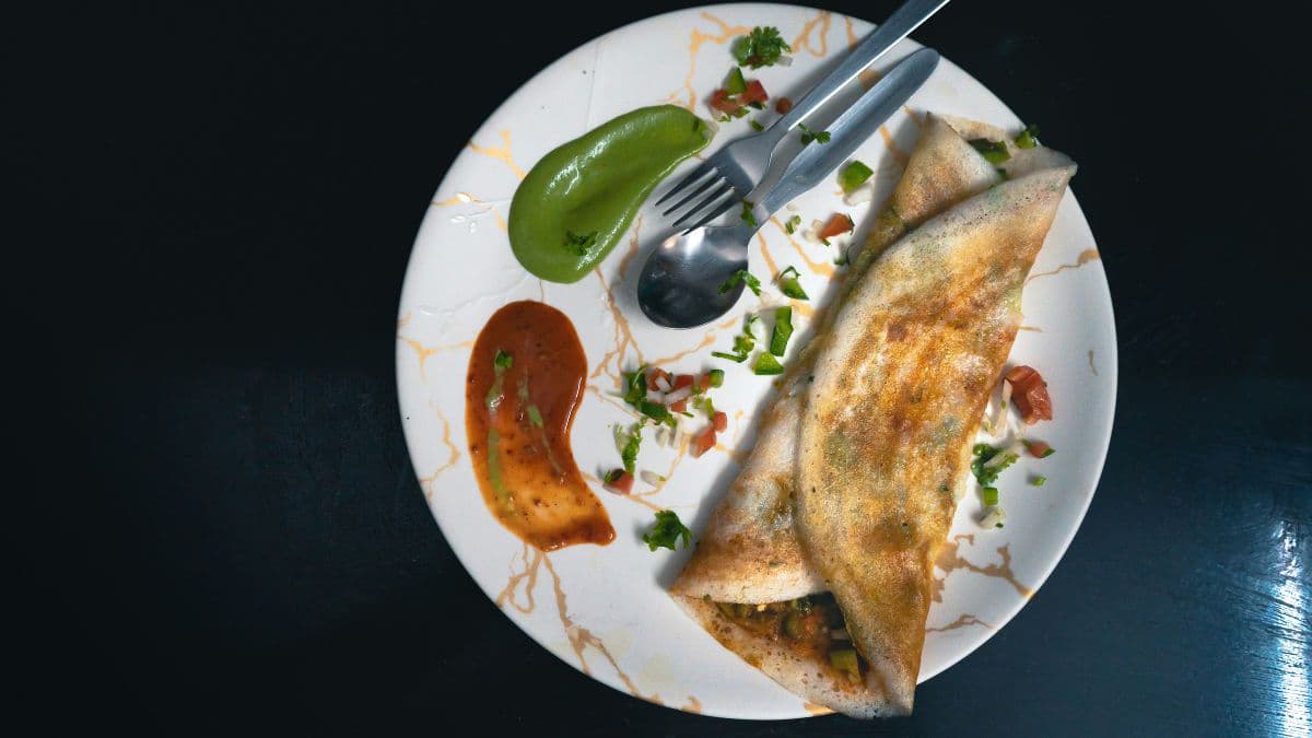 Plate of crispy dosa served with chutney
