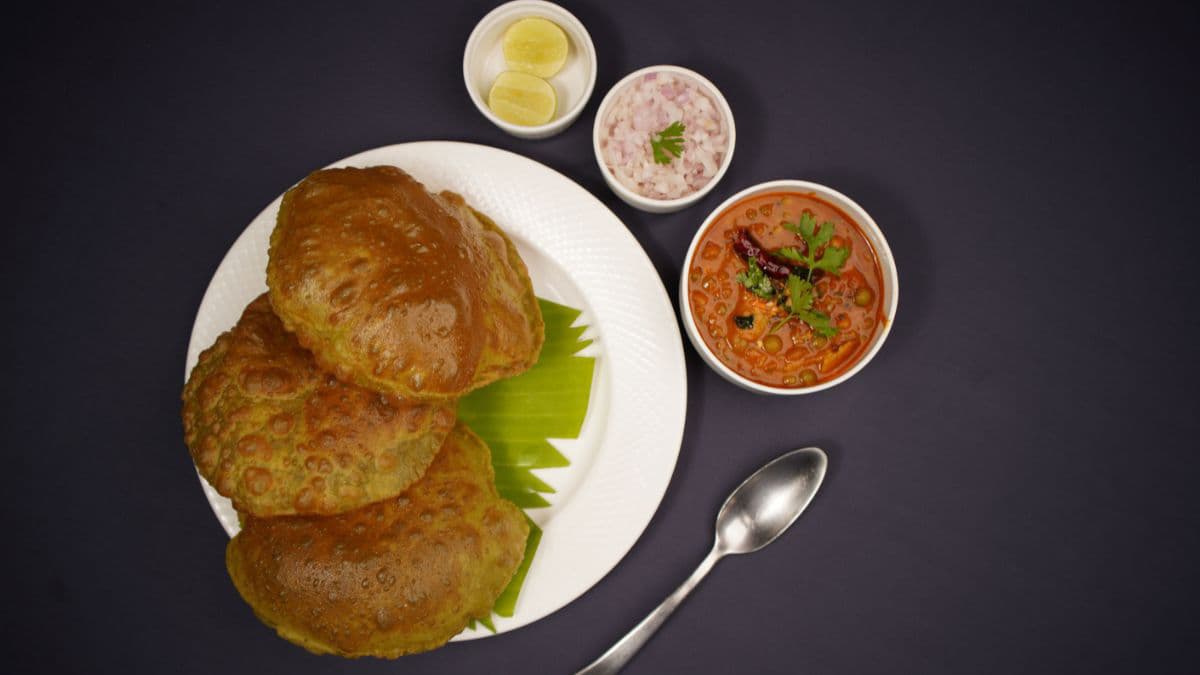 Golden puffed puris made with Khapli atta