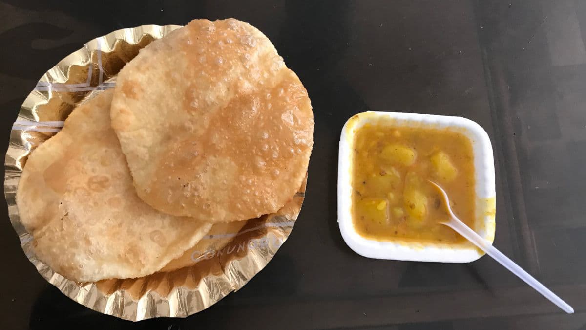 Fluffy luchi served with cholar dal