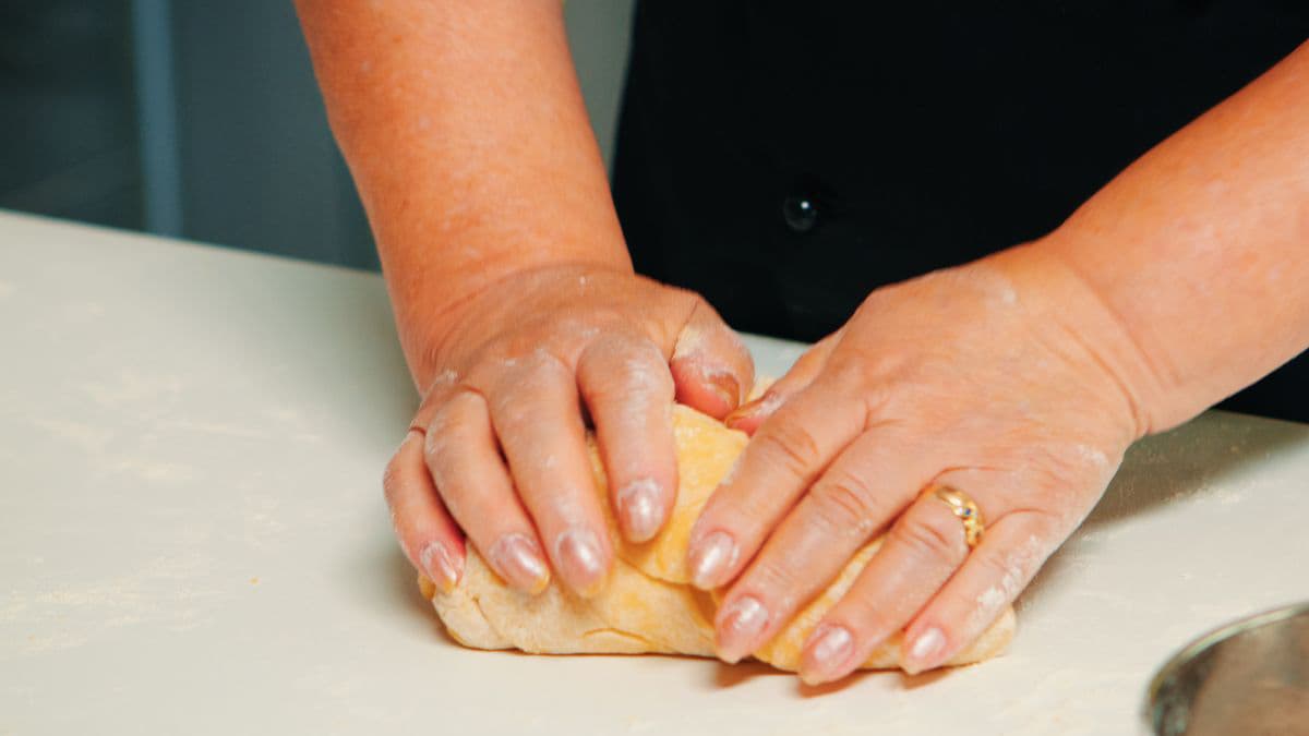 Kneading croissant dough for flaky homemade layers