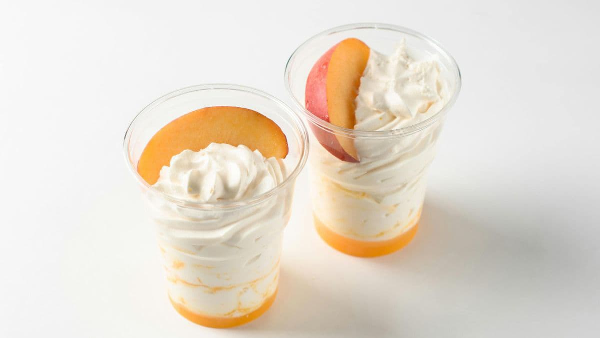 Peaches and cream in a dessert glass