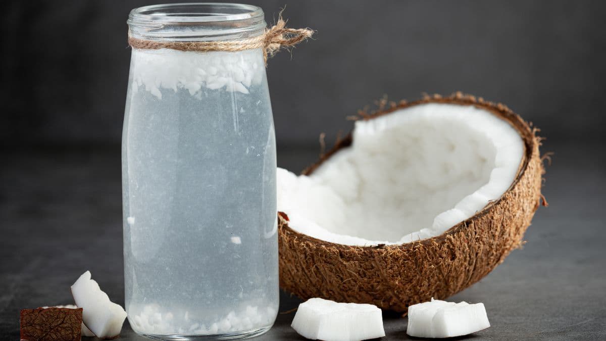 Fresh coconut water in a glass bottle 