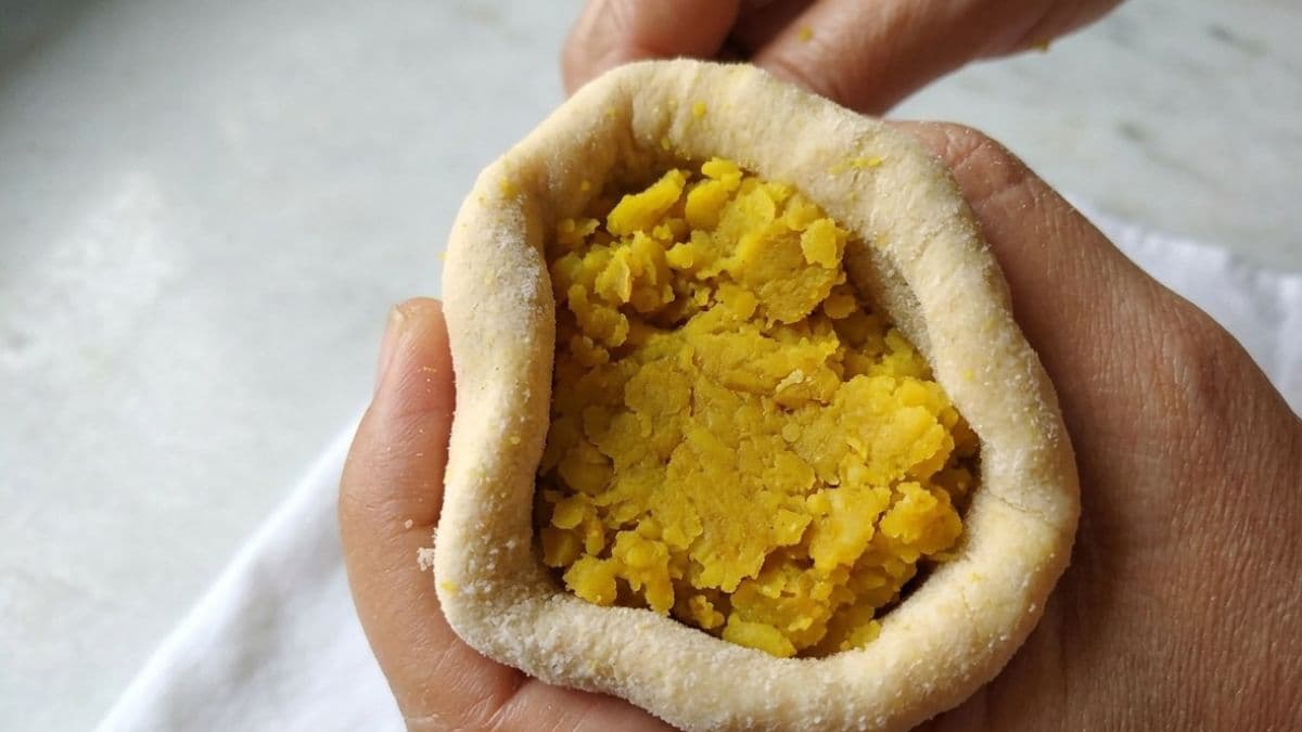 Sweet dal filling inside a wheat dough ball 