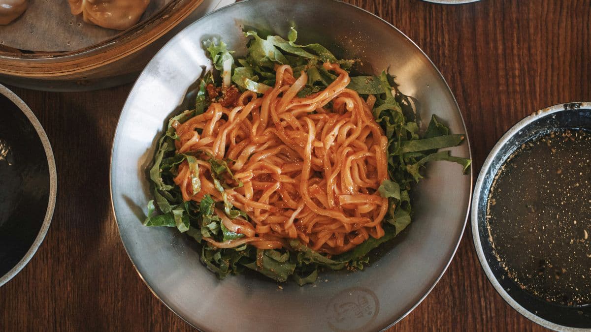 Spicy Korean-style noodle bowl with vegetables 