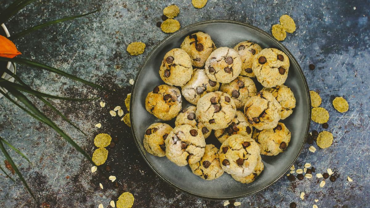 Crunchy homemade cookies served on a black plate 