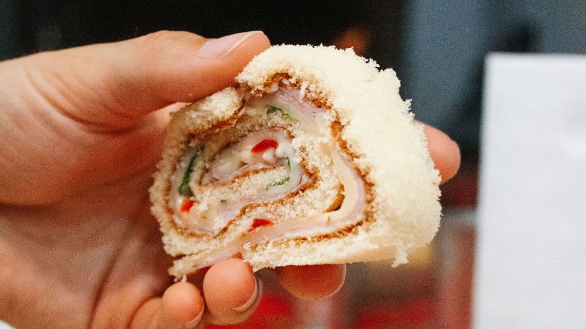 A pinwheel sandwich in a hand