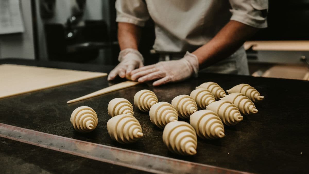 Folding croissant dough to create flaky layers 