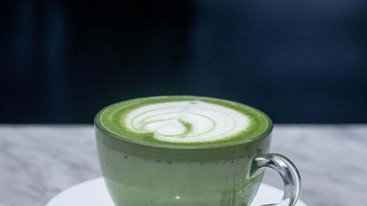 Dirty matcha latte in a cup.
