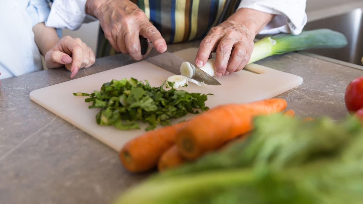 Cutting vegetables on a chopping board
