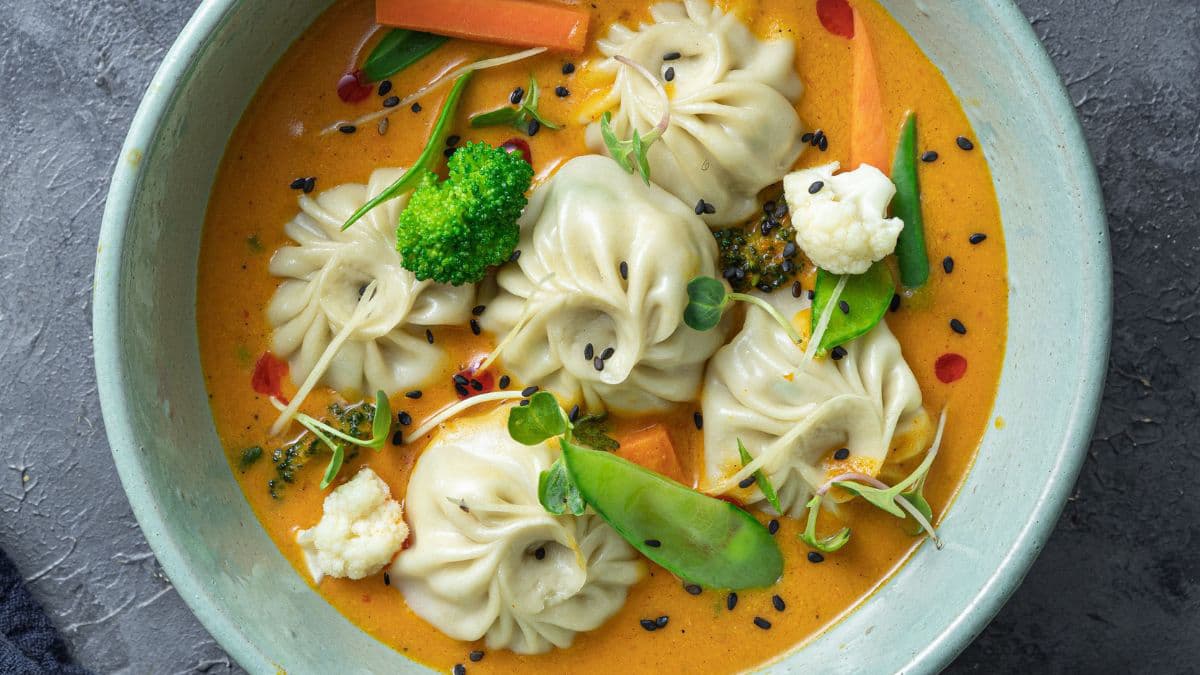 Jhol momos in a bowl.