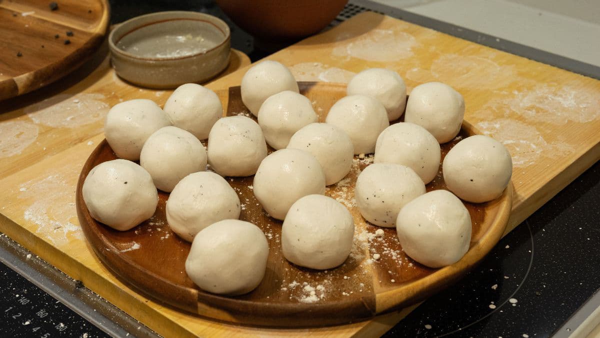 Freshly prepared wheat dough balls on a plate 