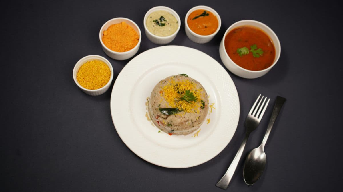 Rava upma on a plate with sides.