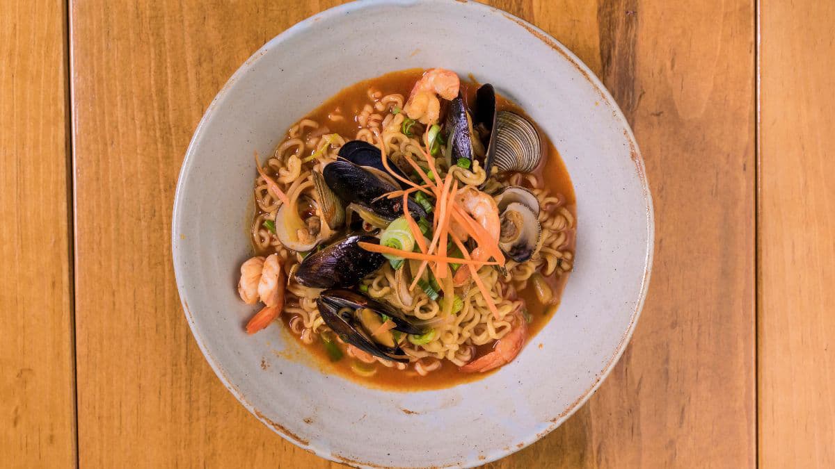 Miso-style ramen bowl with fresh vegetables 