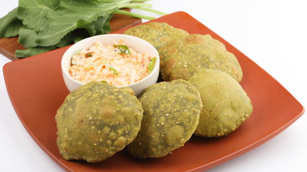Green palak poori served with curry 