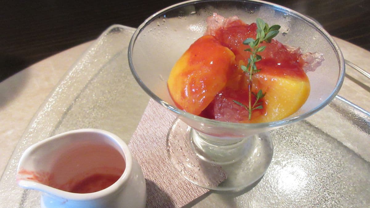 Peach Melba with raspberry sauce