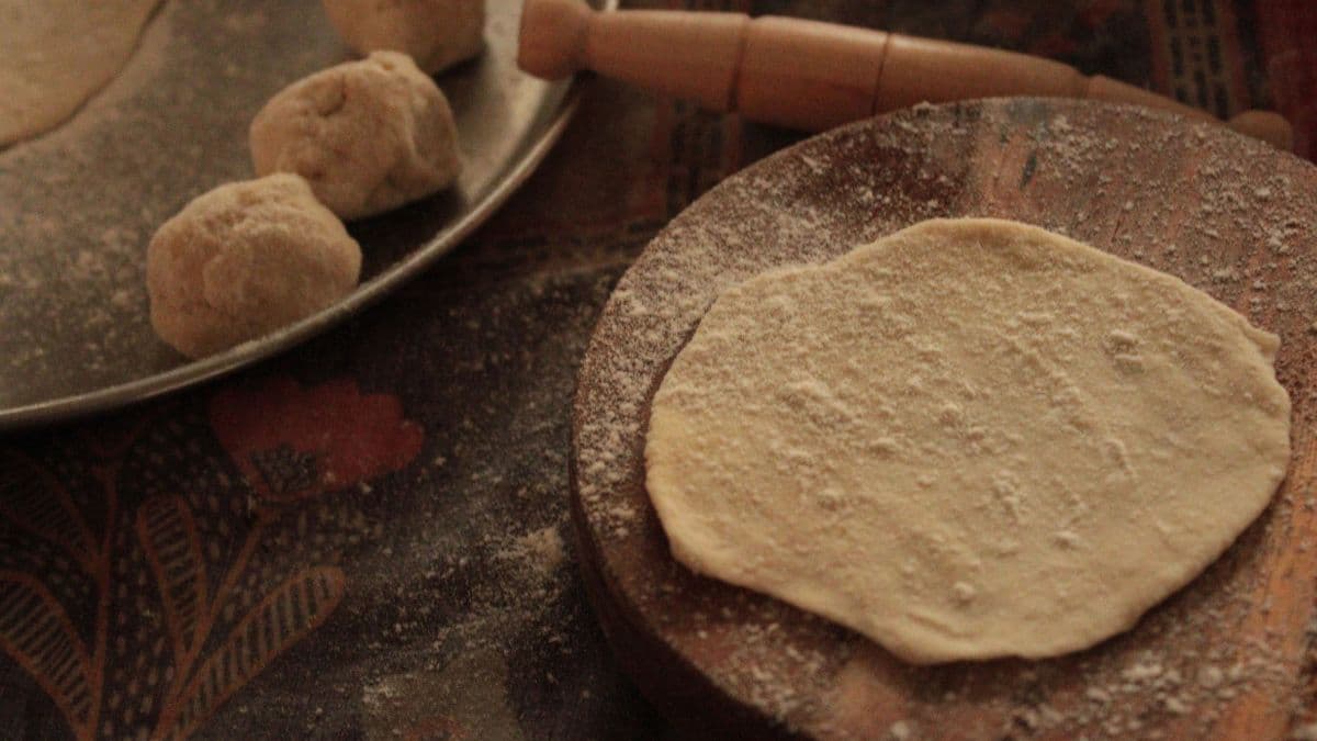 Rolling rotis to even thickness 