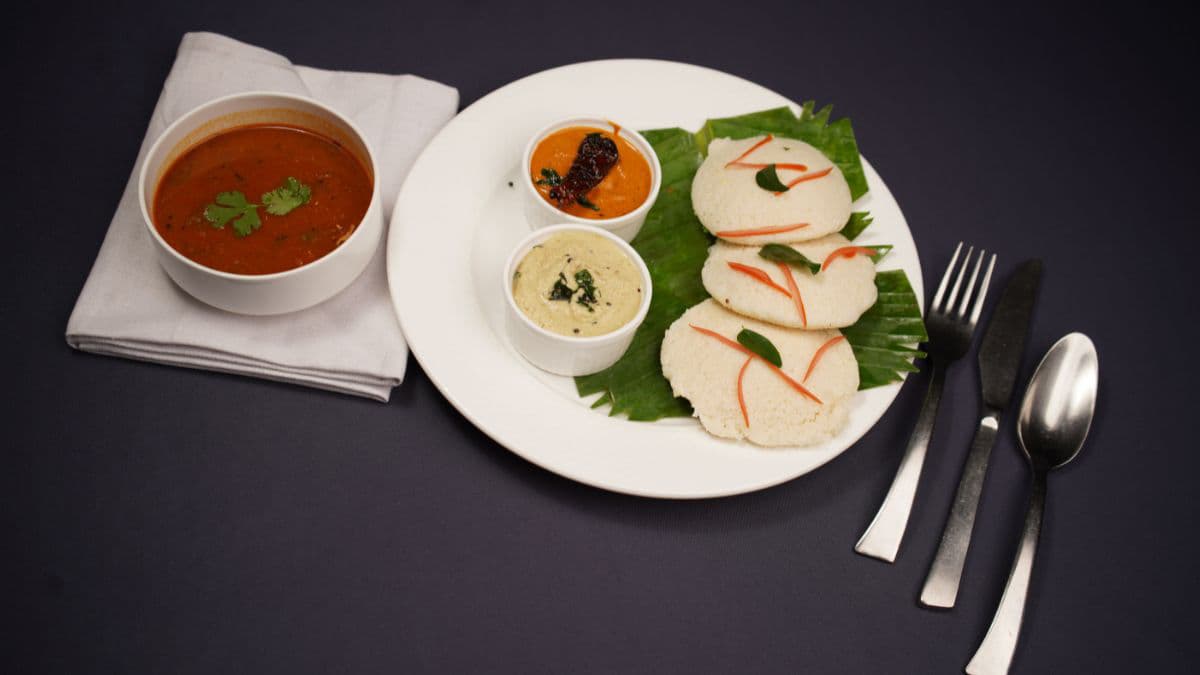 Soft steamed idlis served with sambar and chutney 