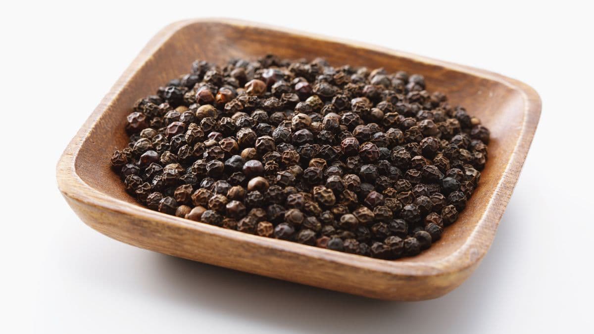 Black pepper in a dish.