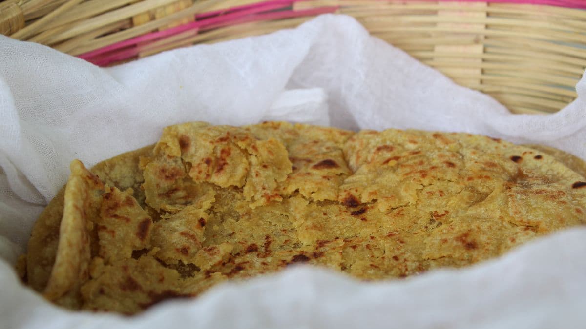 Roasted khapli wheat boli in a cloth basket 