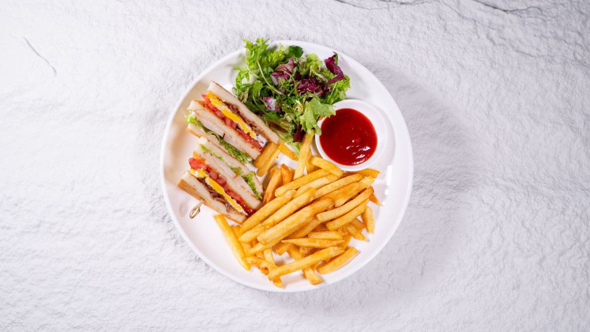 Club sandwich with some fries