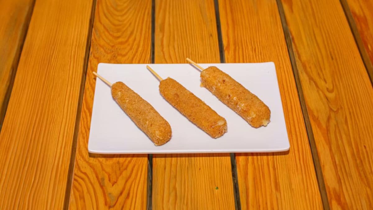 Corn dog covered in breadcrumbs