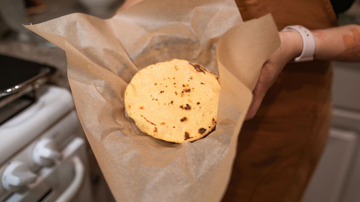 Soft whole wheat roti held for fresh serving 