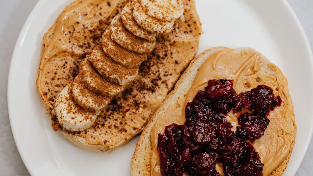 Peanut butter spread over the bread slice