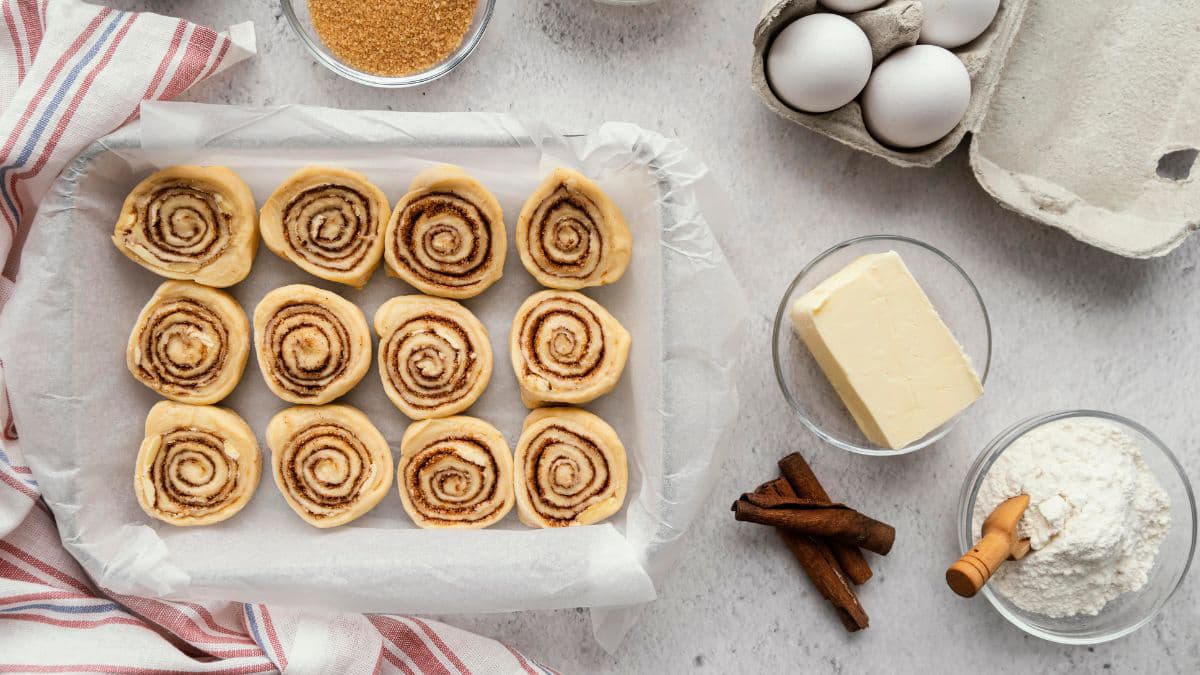Cinnamon rolls resting during second proof 