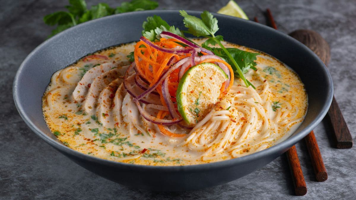 Thai-inspired coconut noodle bowl with vegetables